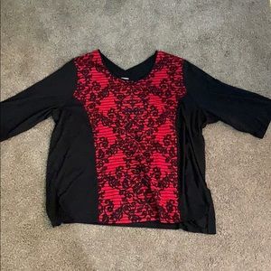 red and black blouse that has a little stretch